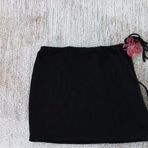 Black Skirt with Pink Flower Accent